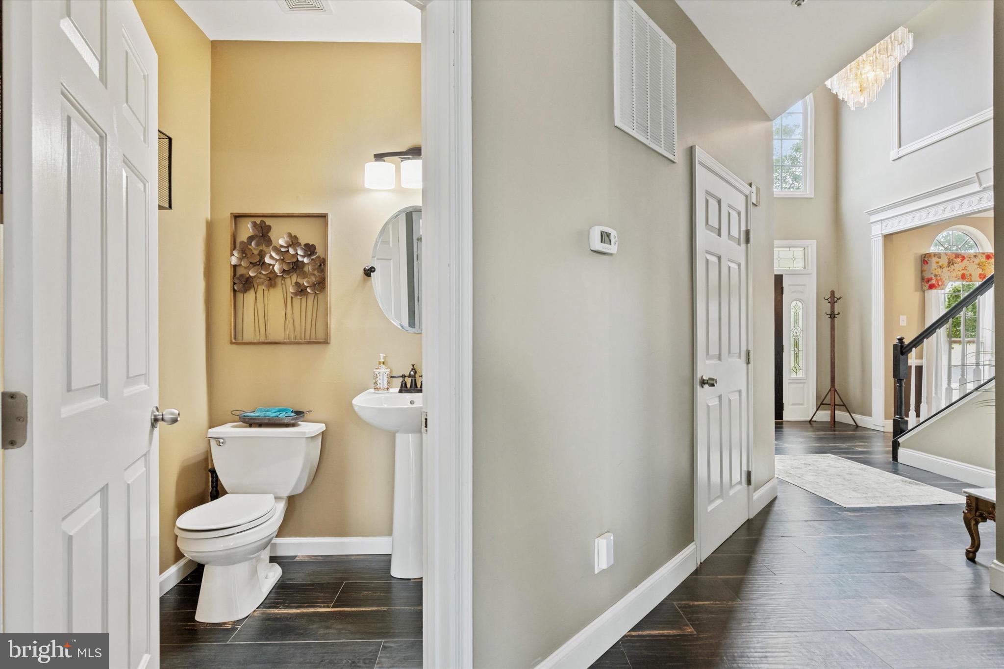 803 Sweet Cherry Street Warrington, PA 18976 - Photo 22 of 35 a bathroom with a toilet and a shower curtain