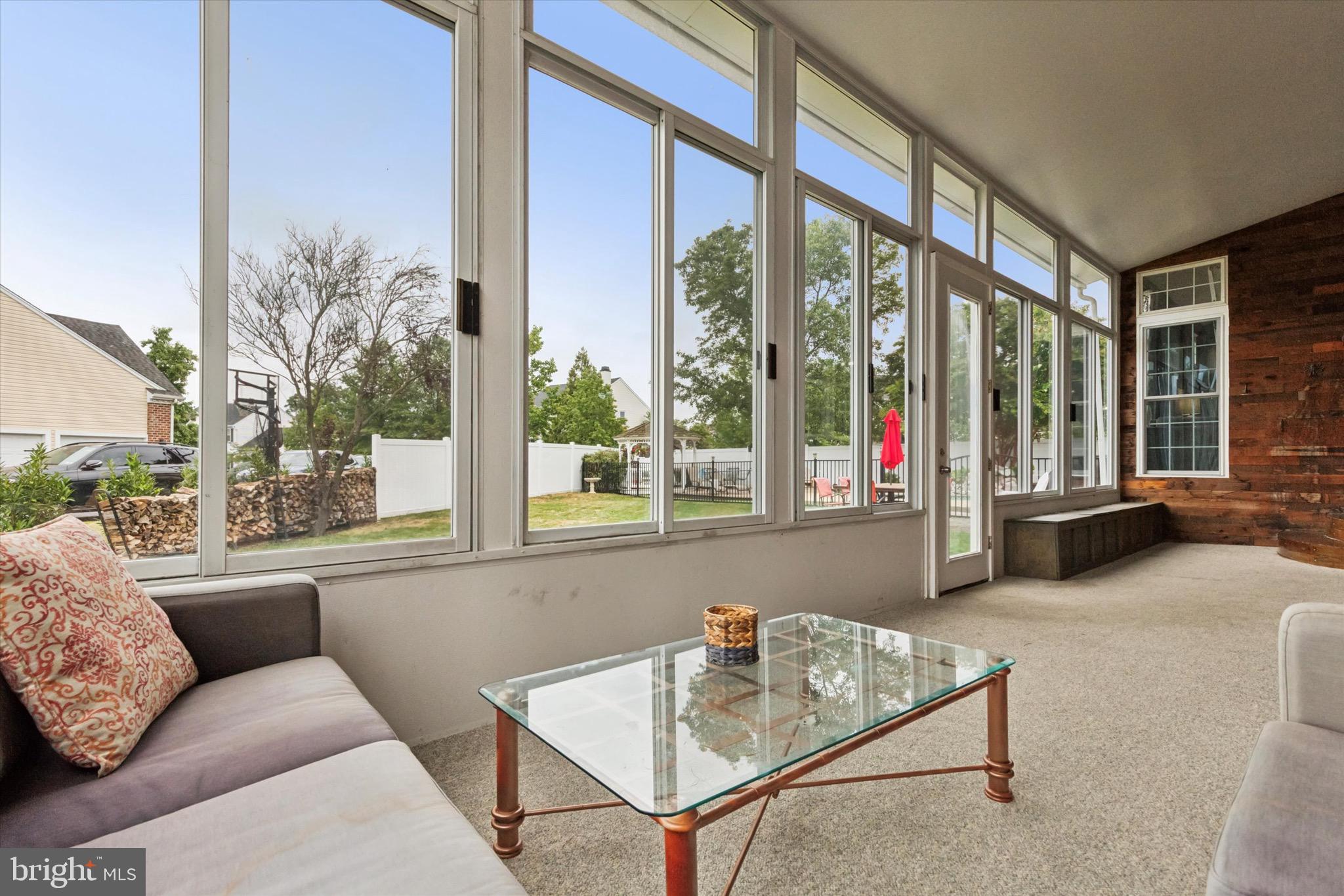 803 Sweet Cherry Street Warrington, PA 18976 - Photo 30 of 35 a living room with furniture and a large window