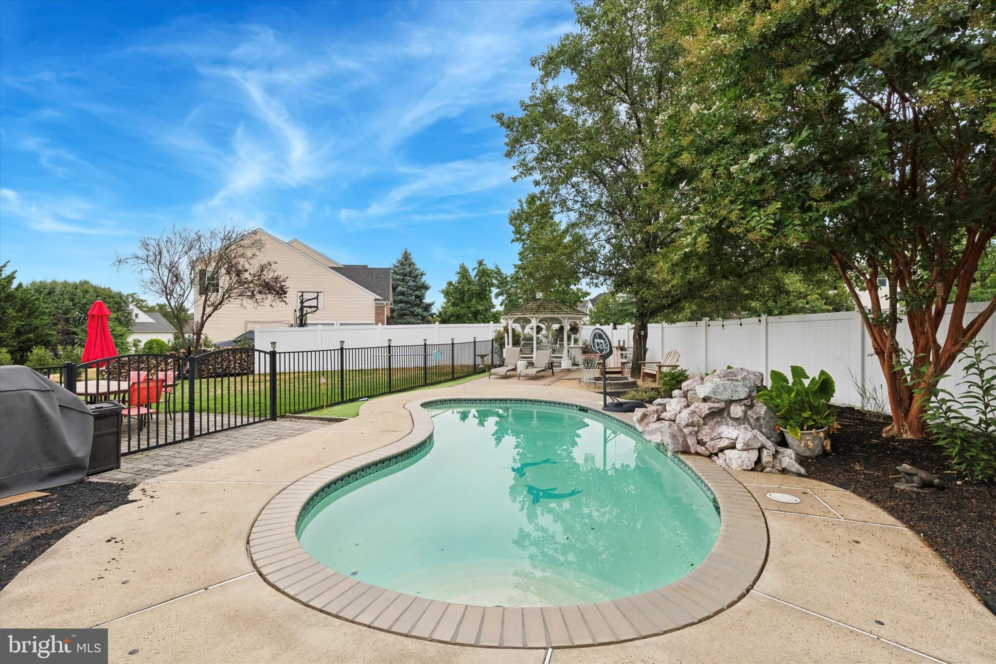 803 Sweet Cherry Street Warrington, PA 18976 - Photo 33 of 35 swimming pool view with a garden space