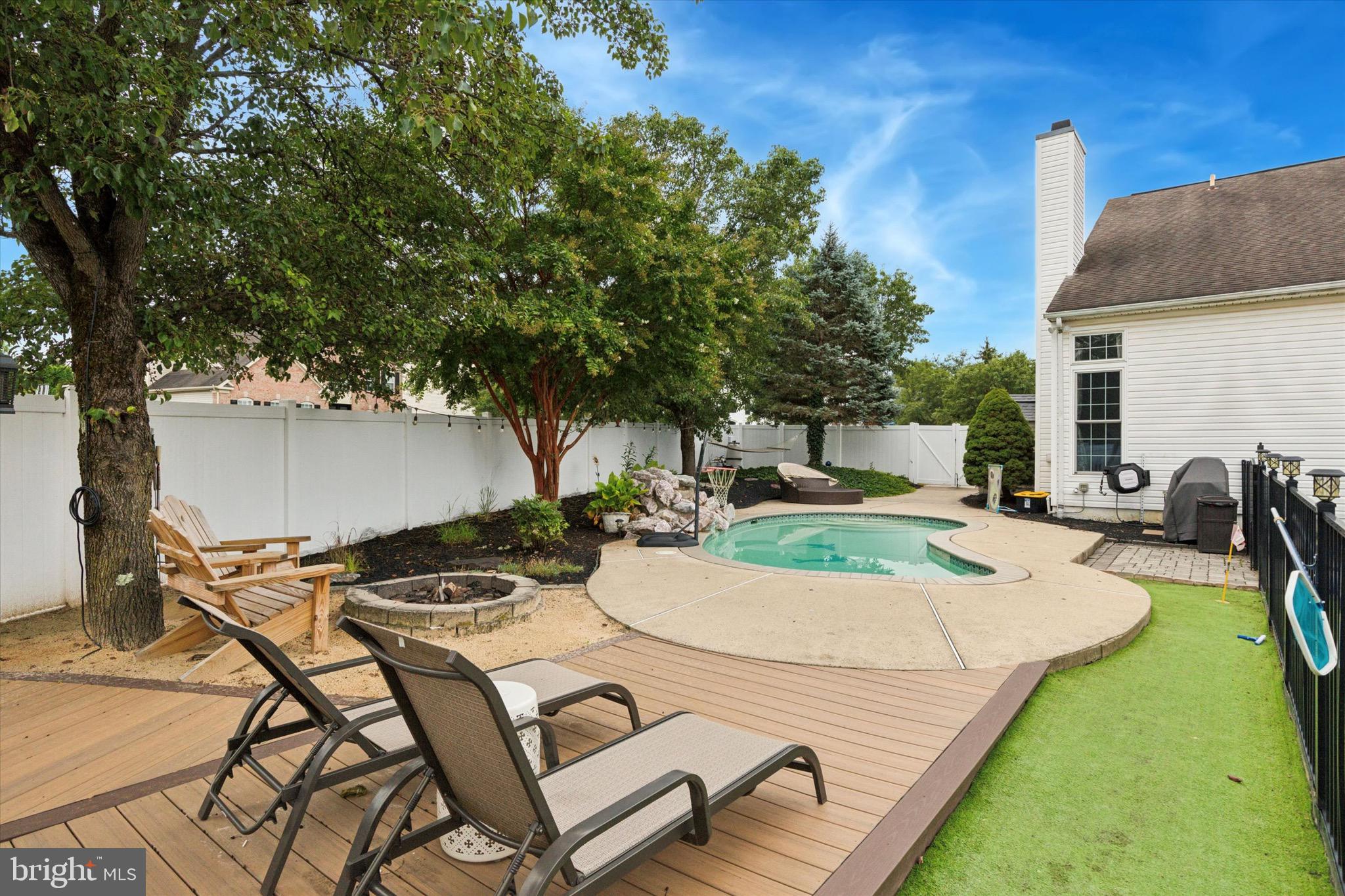 803 Sweet Cherry Street Warrington, PA 18976 - Photo 34 of 35 a view of backyard of a house with yard fire pit table and chairs