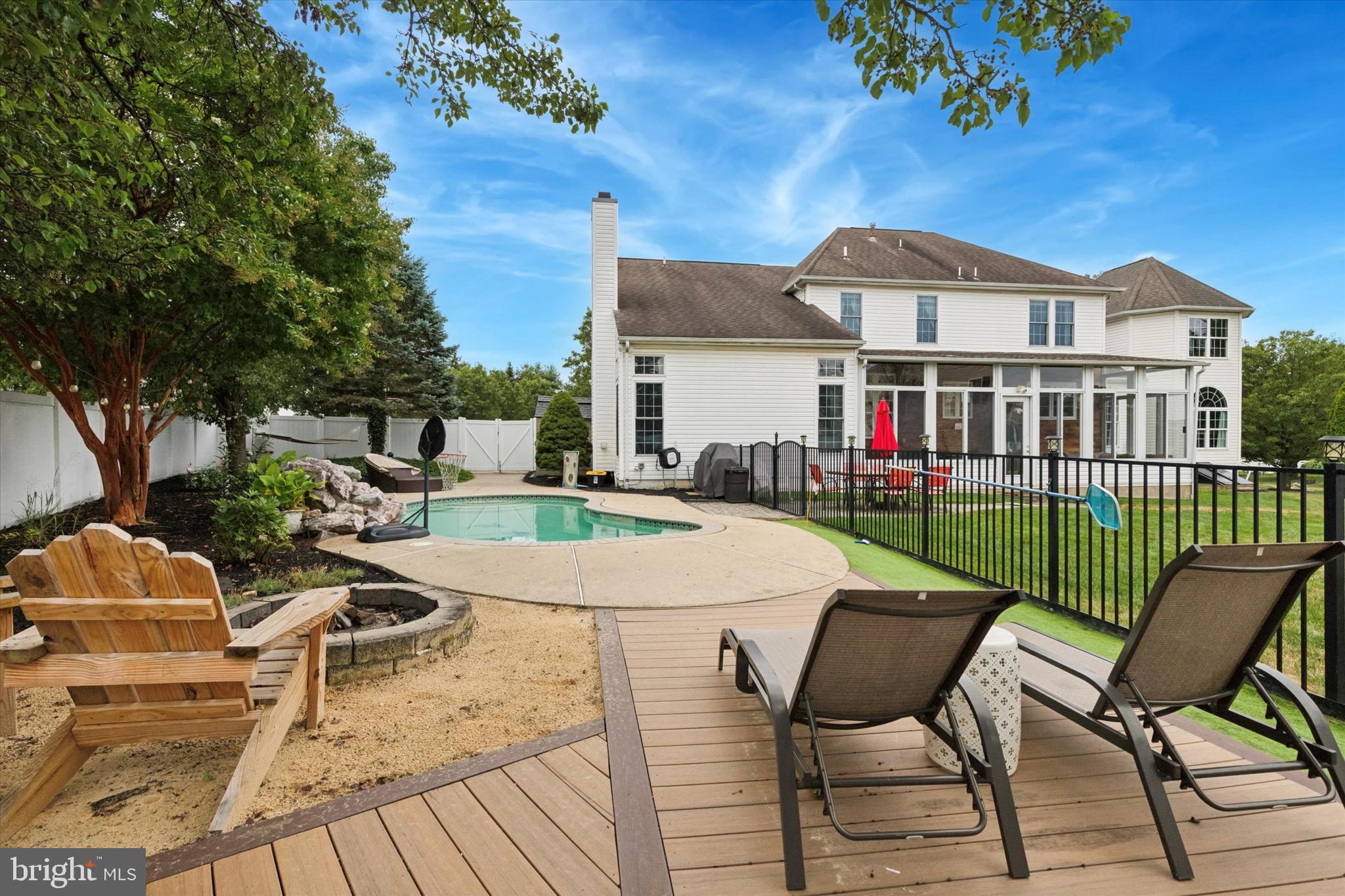 803 Sweet Cherry Street Warrington, PA 18976 - Photo 35 of 35 a view of a patio with couches table and chairs and potted plants