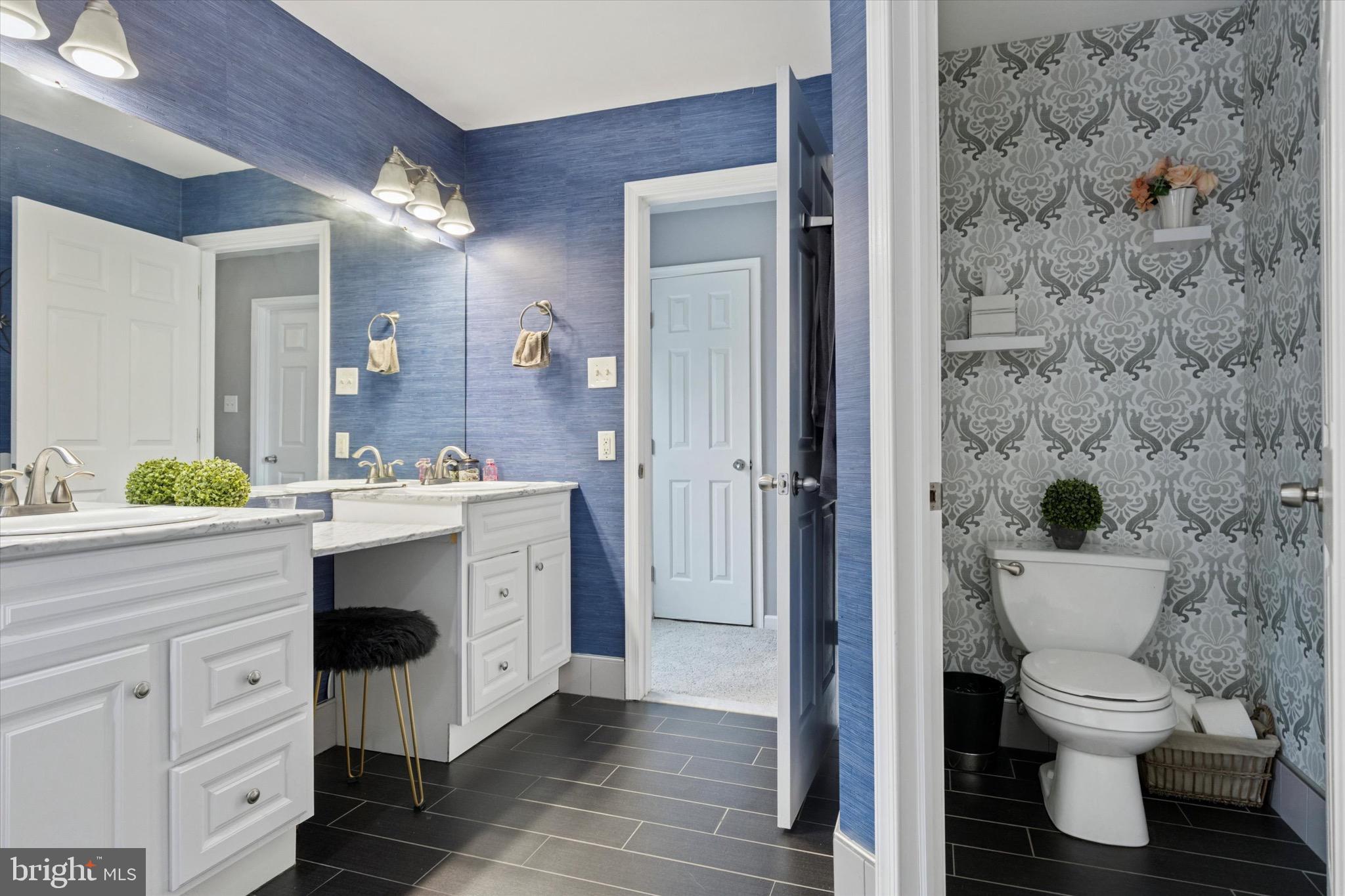 803 Sweet Cherry Street Warrington, PA 18976 - Photo 10 of 35 a spacious bathroom with a toilet sink and a mirror