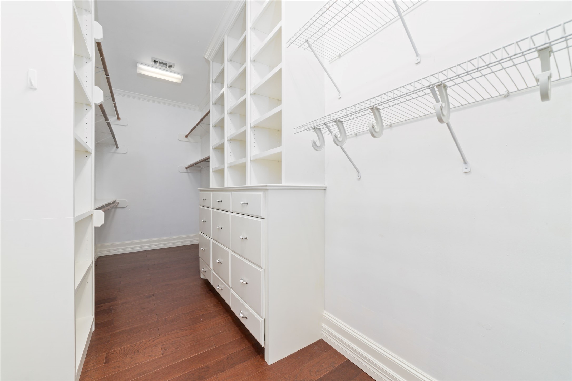16114 Lafone Drive Spring, TX 77379 - Photo 20 of 45 The first of two dreamy primary bedroom closets, complete with closet organization/custom built-ins.