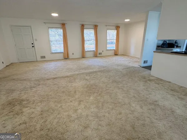 an empty room with windows