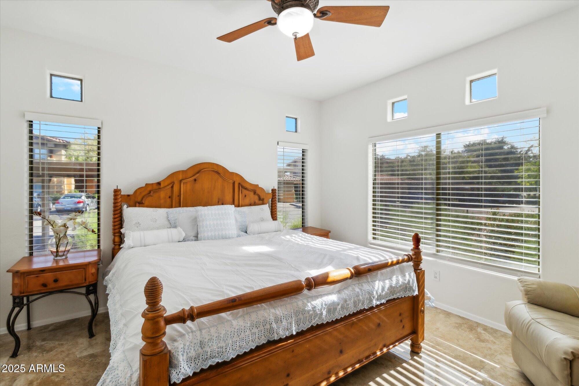 9100 East Raintree Drive, Unit 130 Scottsdale, AZ 85260 - Photo 14 of 17 a bedroom with a bed and a window