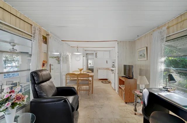 a room with furniture or couch and a flat screen tv