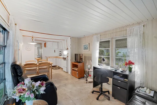 a view of a workspace with furniture and toys