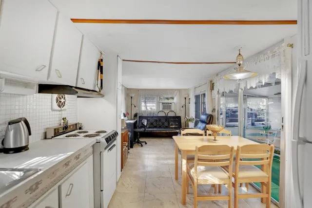 a kitchen with stainless steel appliances granite countertop a sink and cabinets