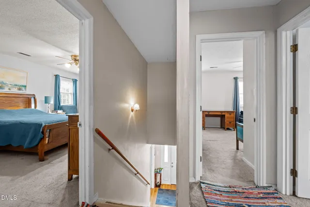a living room with furniture a ceiling fan and a window