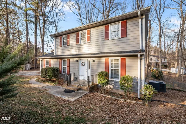 a view of a backyard with large trees