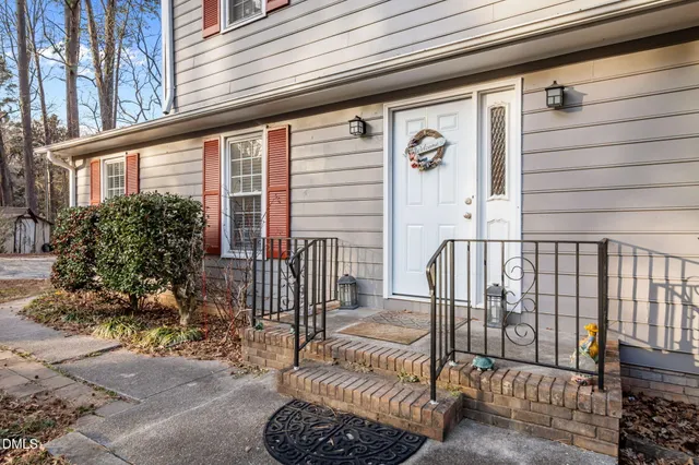 a view of a house with wooden deck
