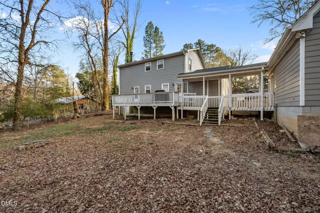 a front view of a house with a table and chairs