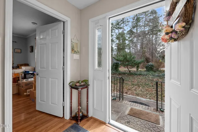 a view of an entryway with wooden floor