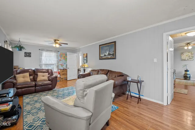 a view of empty room with a fireplace and potted plants