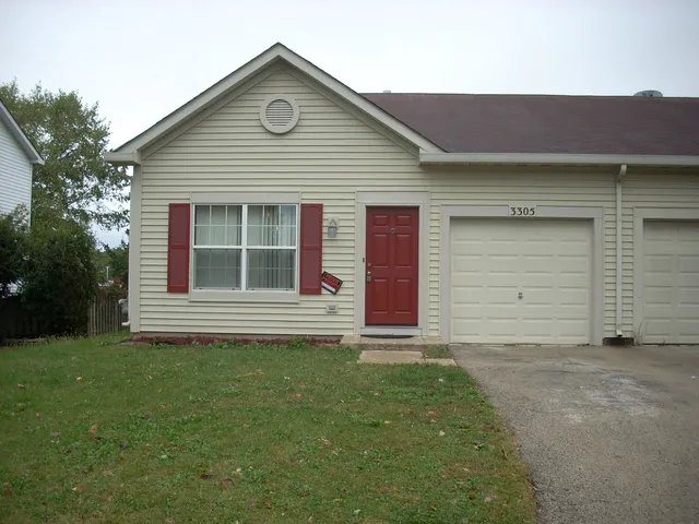 a front view of a house with a garage