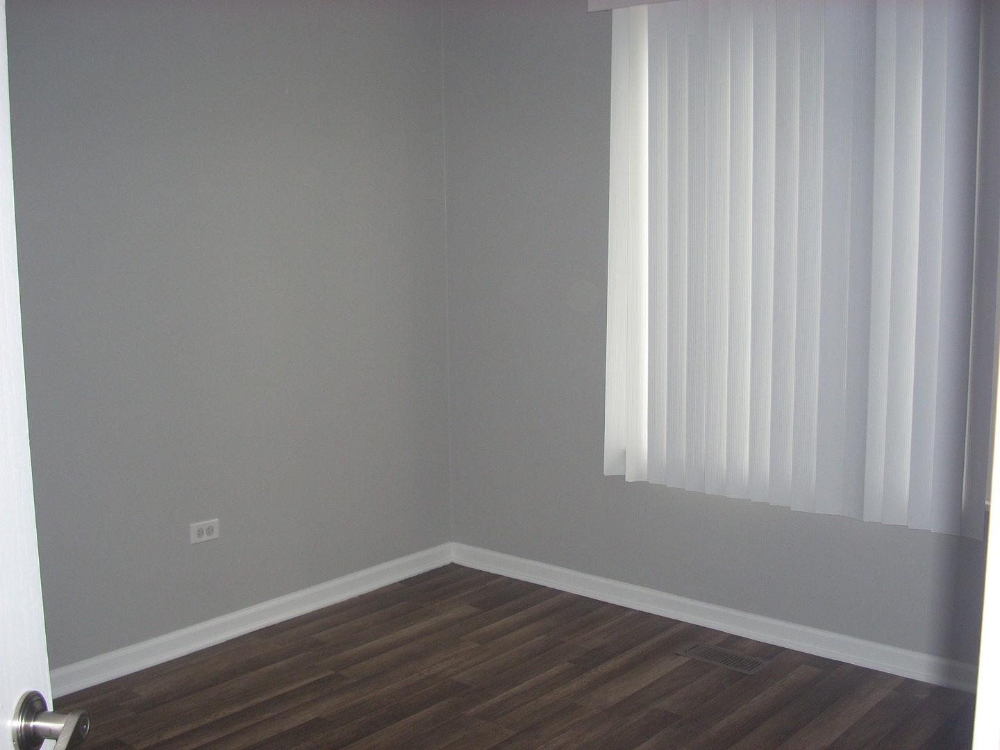 3305 Paige Street Plano, IL 60545 - Photo 15 of 20 a view of a small space with wooden floor and a window