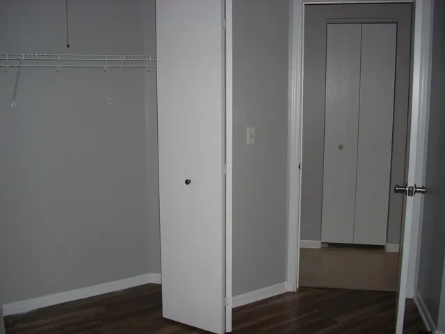 a view of front door with wooden floor