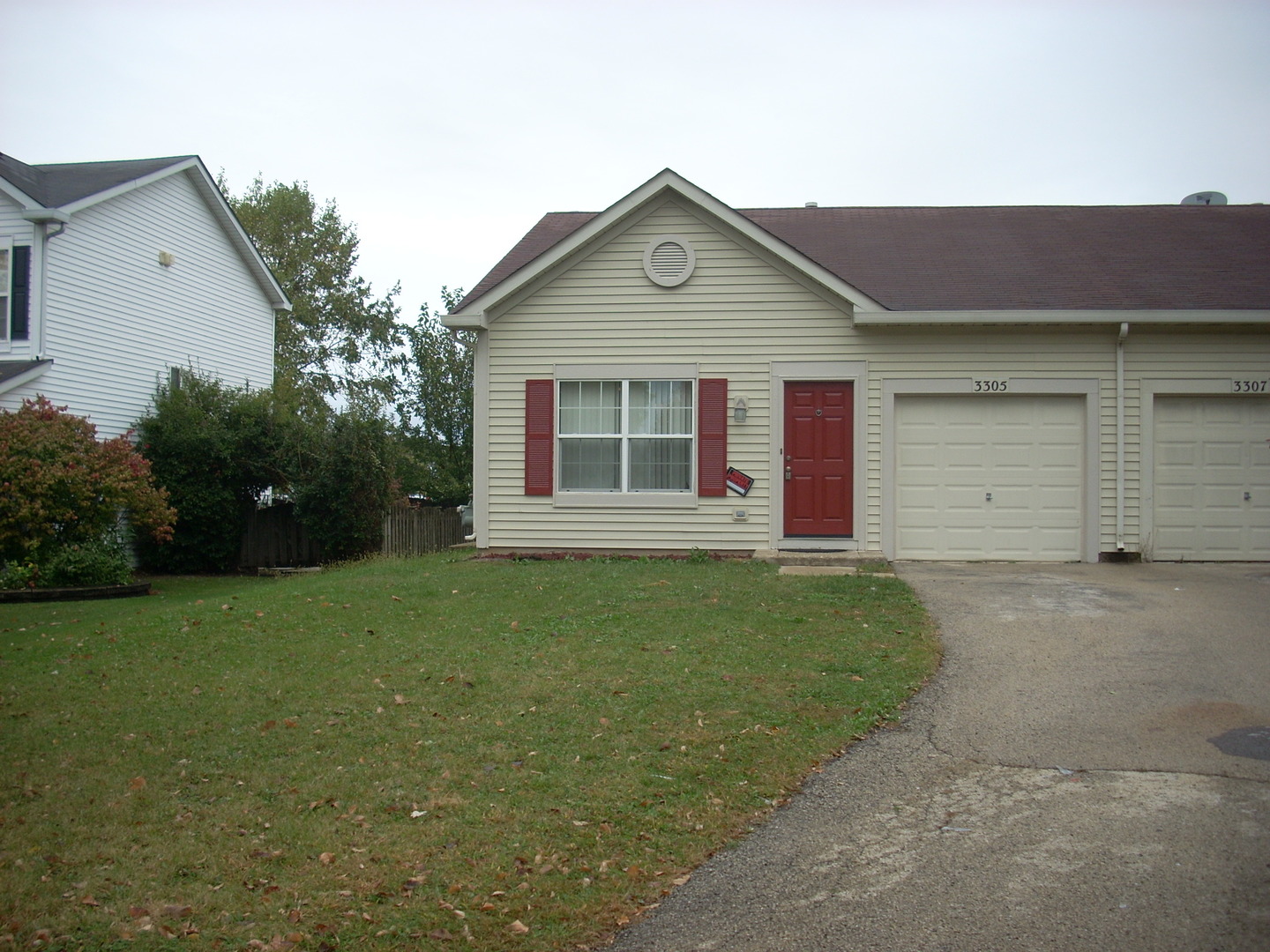 3305 Paige Street Plano, IL 60545 - Photo 2 of 20 a view of a house with a yard and garage