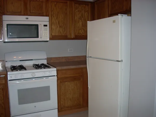 a kitchen with a stove and a microwave
