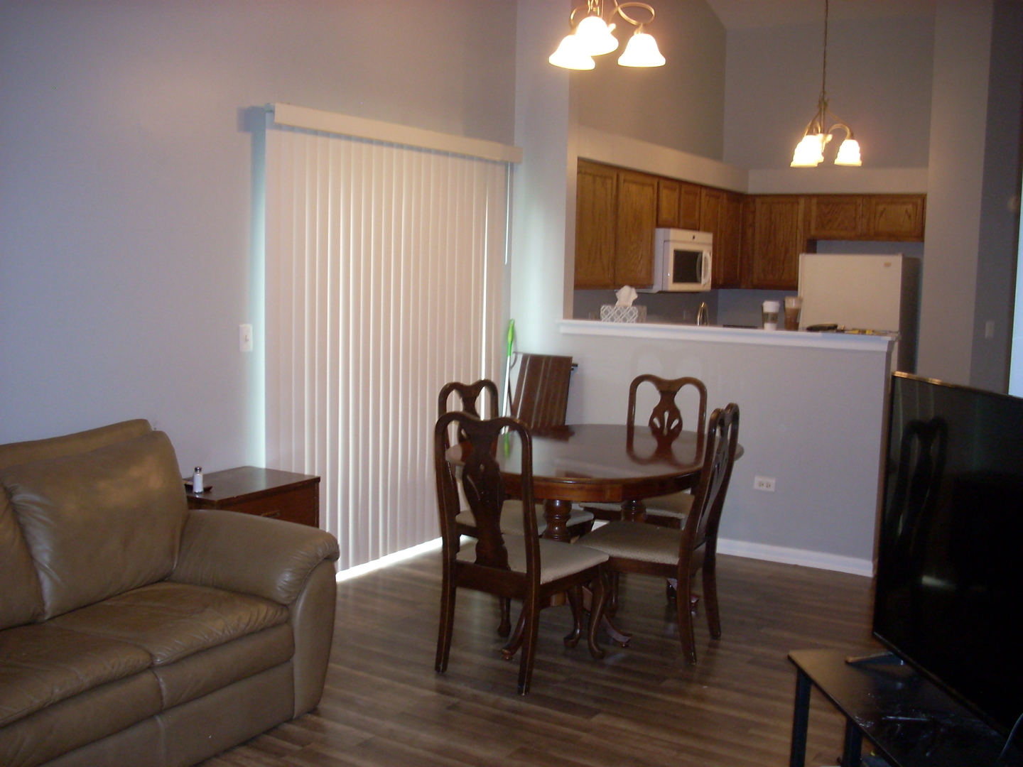 3305 Paige Street Plano, IL 60545 - Photo 7 of 20 a view of a dining room with furniture and wooden floor