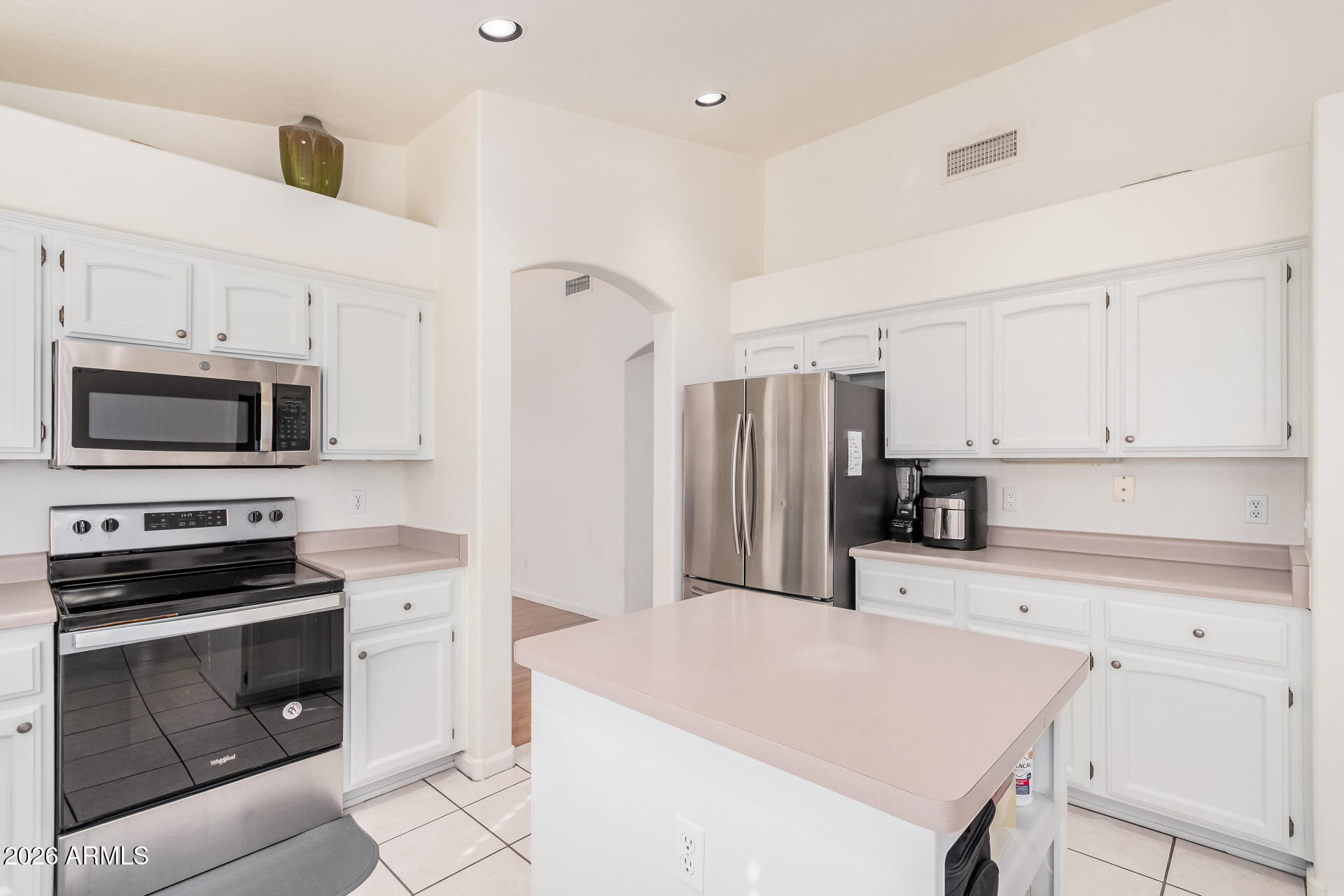 17433 North 20th Street Phoenix, AZ 85022 - Photo 14 of 29 a kitchen with stainless steel appliances a stove microwave and refrigerator