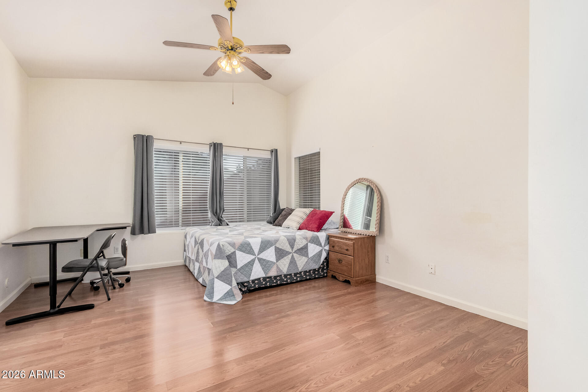 17433 North 20th Street Phoenix, AZ 85022 - Photo 17 of 29 a bed room with a bed and a chair