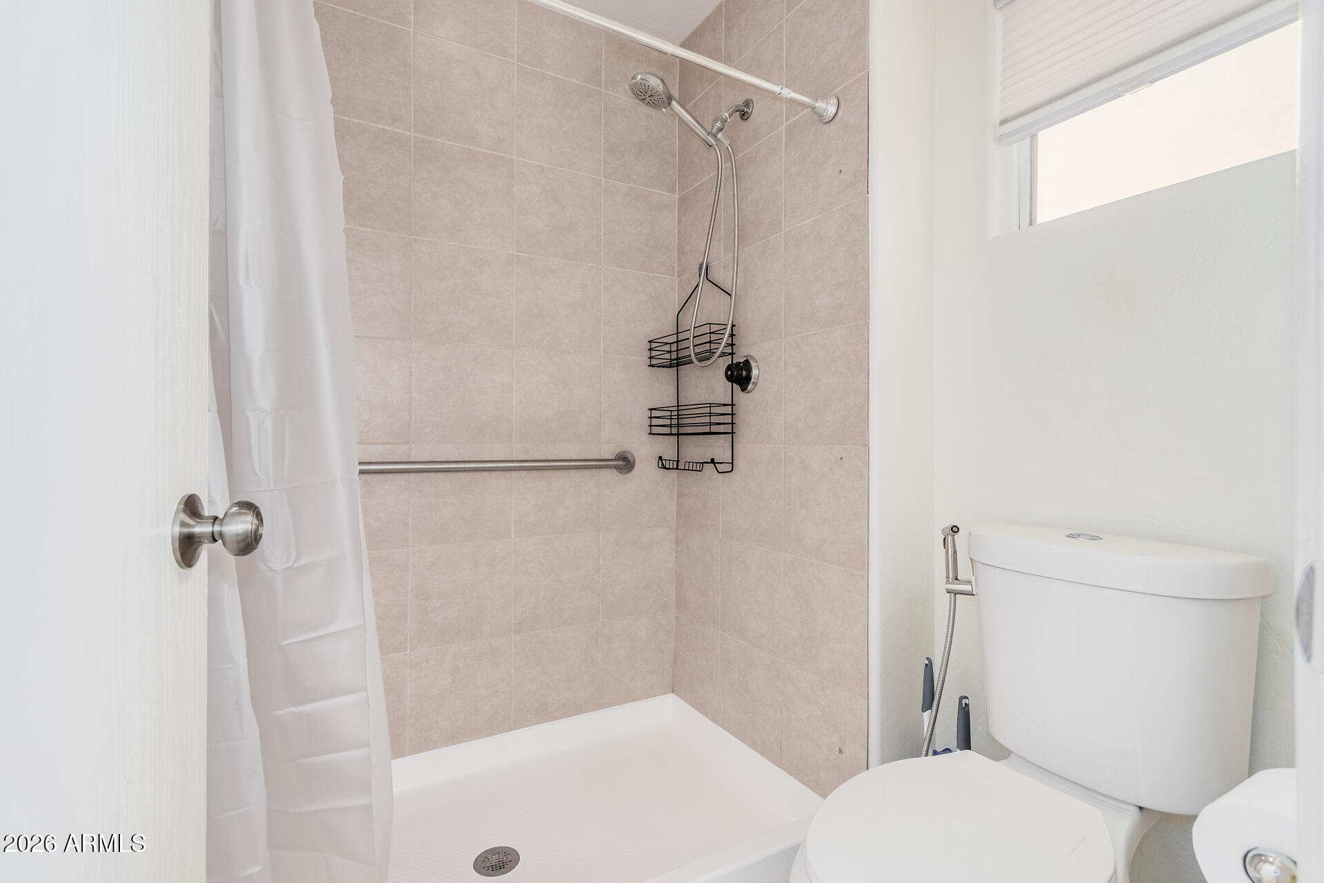 17433 North 20th Street Phoenix, AZ 85022 - Photo 20 of 29 a bathroom with a shower and toilet