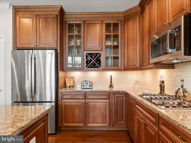 a view of a dining room with furniture wooden floor and chandelier