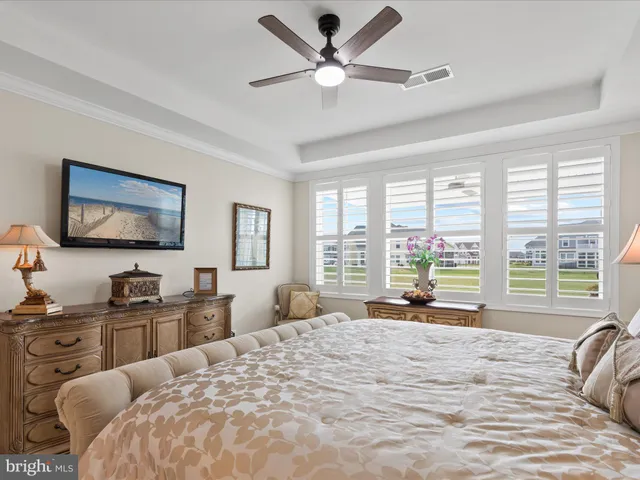 a living room with furniture large window and a fireplace