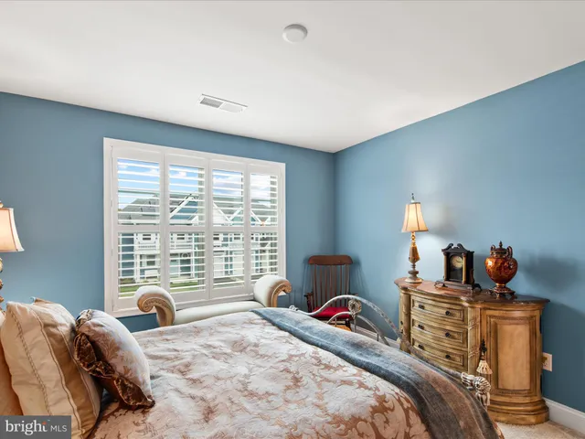 a living room with furniture wooden floor and a fireplace