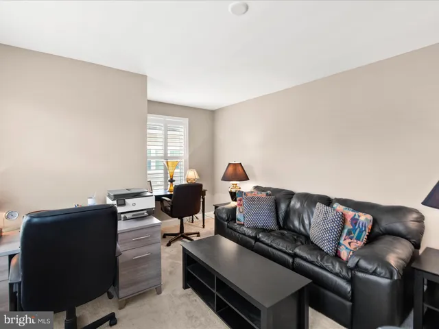 a view of a house with garden and trees