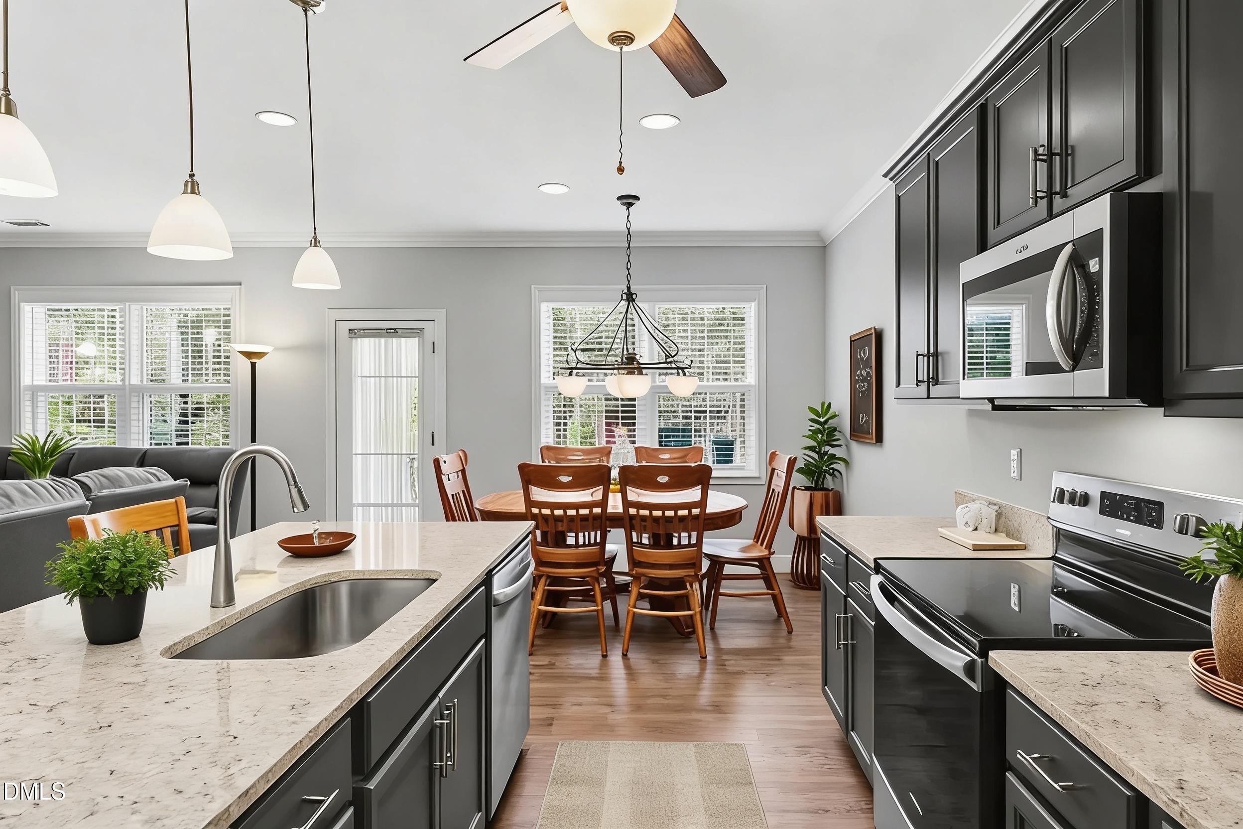 130 Aylebury Ridge Zebulon, NC 27597 - Photo 8 of 41 a kitchen with a stove sink and microwave