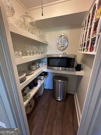 a view of an entryway with wooden floor