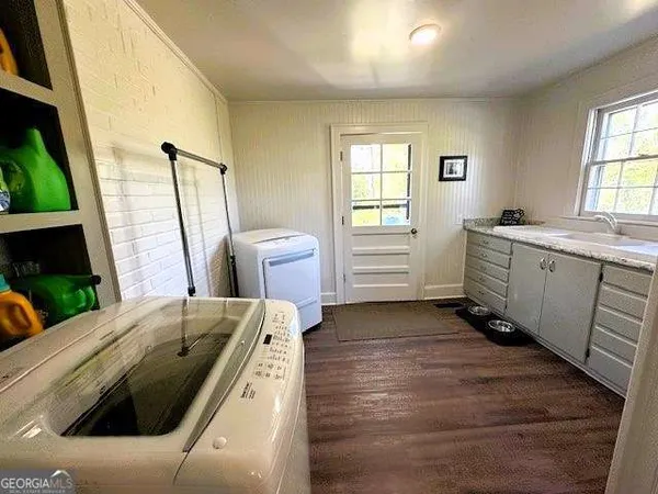 a kitchen with sink and window