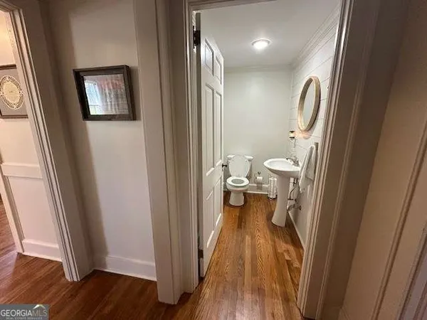 a view of a bathroom from a hallway