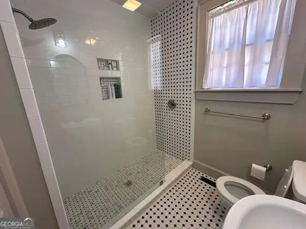 a bathroom with a sink and a shower