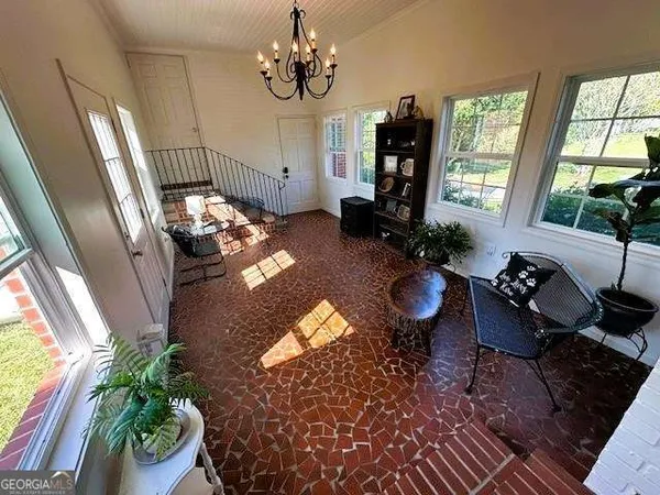 a view of backyard with patio