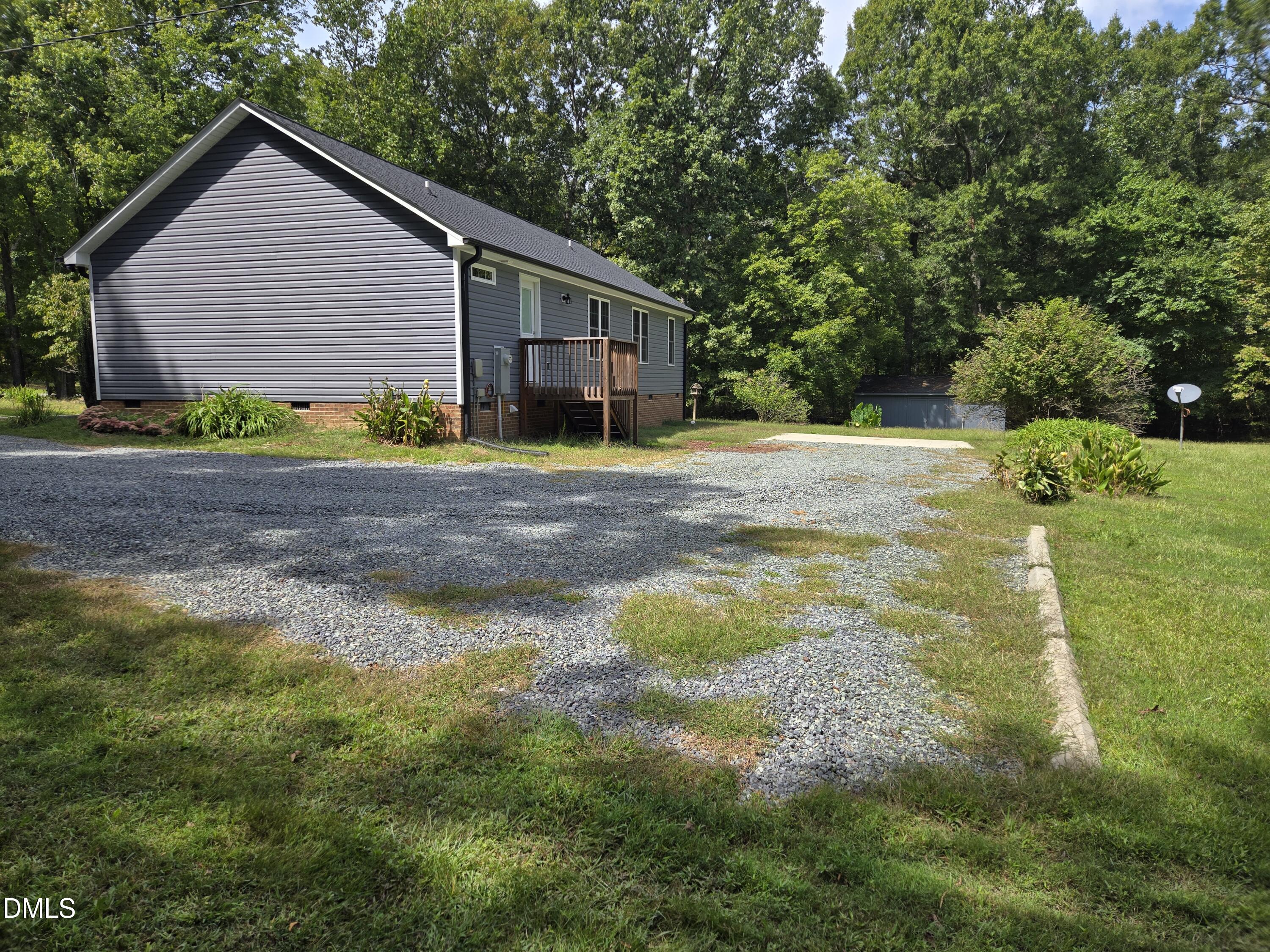 1180 Lambert Chapel Road Siler City, NC 27344 - Photo 11 of 42 a view of a house with backyard and trees