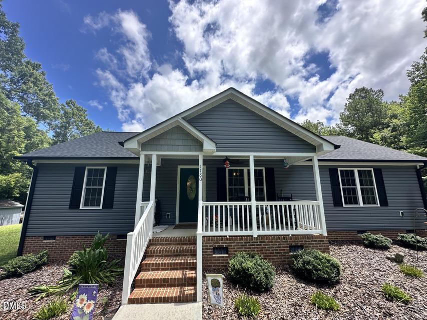 1180 Lambert Chapel Road Siler City, NC 27344 - Photo 13 of 42 a view of a house with a yard