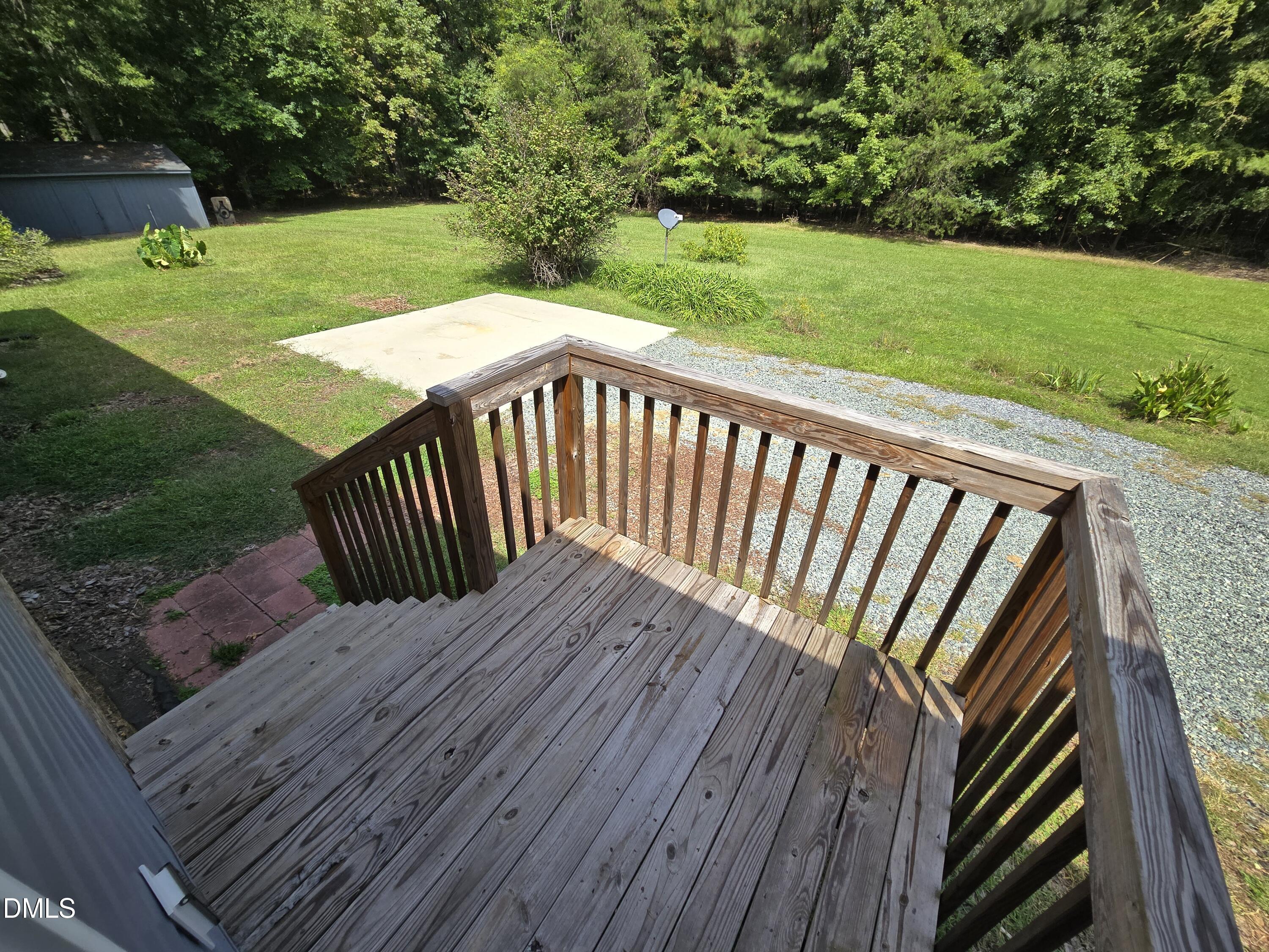1180 Lambert Chapel Road Siler City, NC 27344 - Photo 14 of 42 a view of a deck with a yard