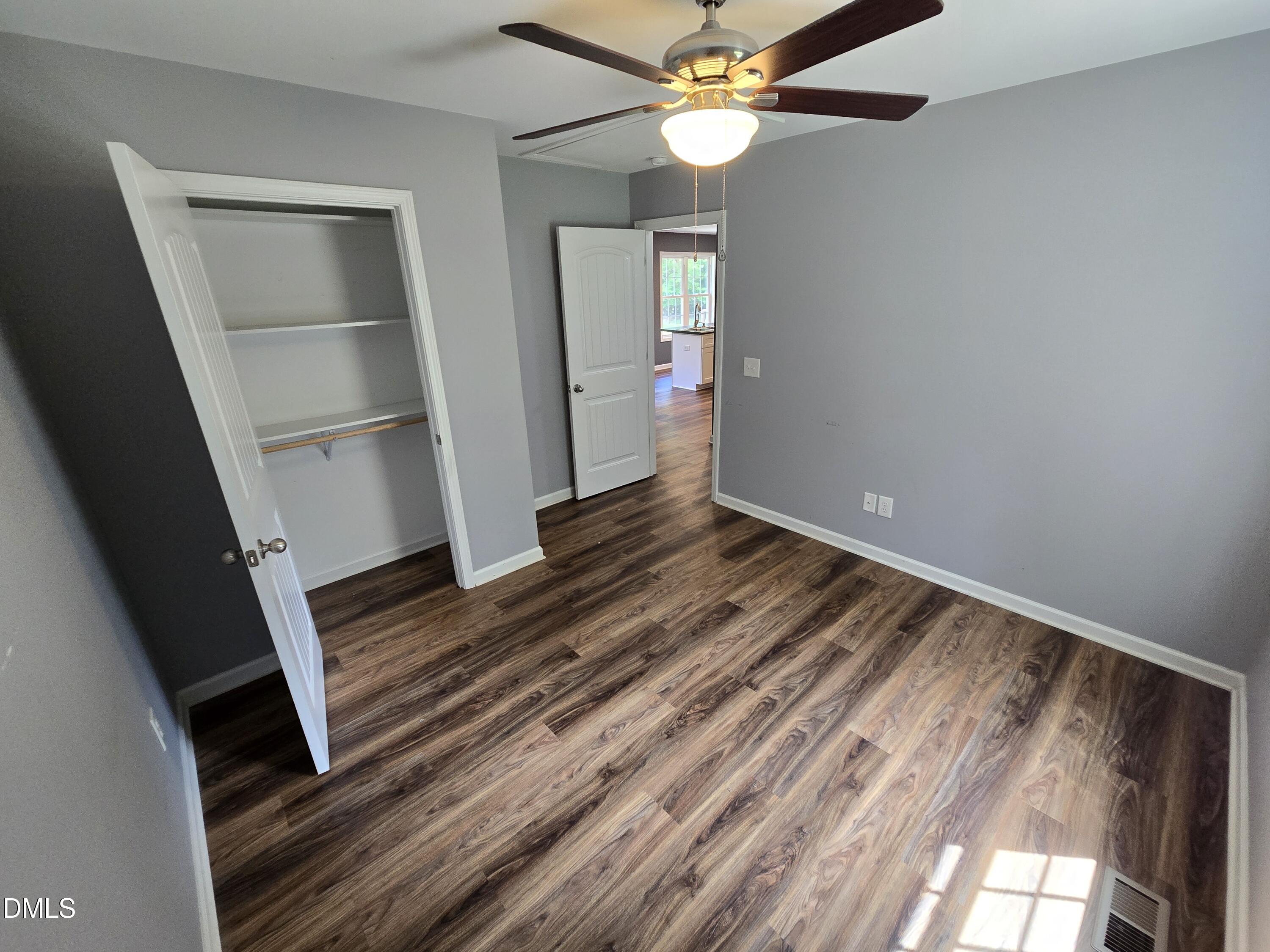 1180 Lambert Chapel Road Siler City, NC 27344 - Photo 23 of 42 wooden floor in an empty room with a window