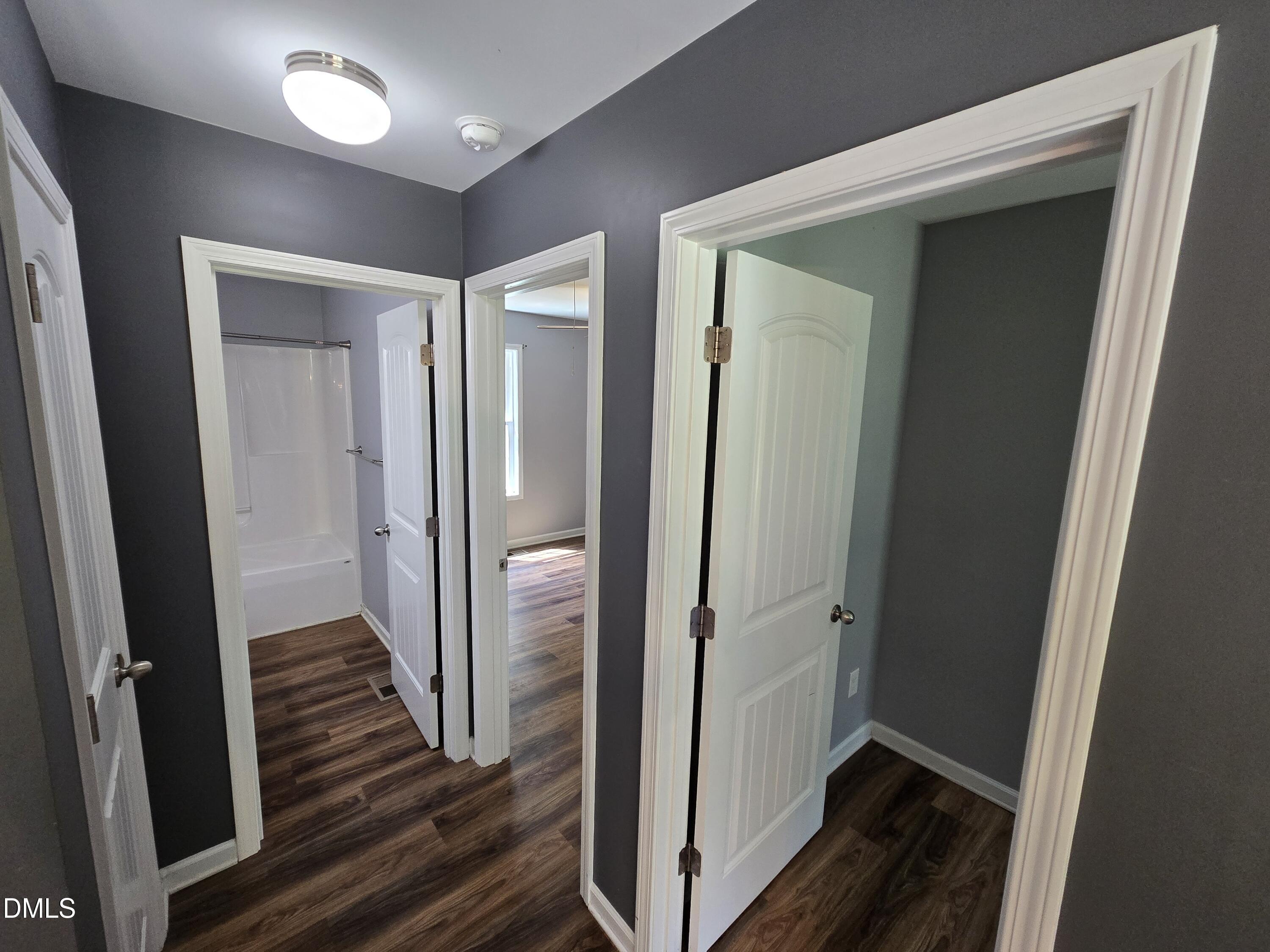 1180 Lambert Chapel Road Siler City, NC 27344 - Photo 27 of 42 a view of a hallway with wooden floor and staircase