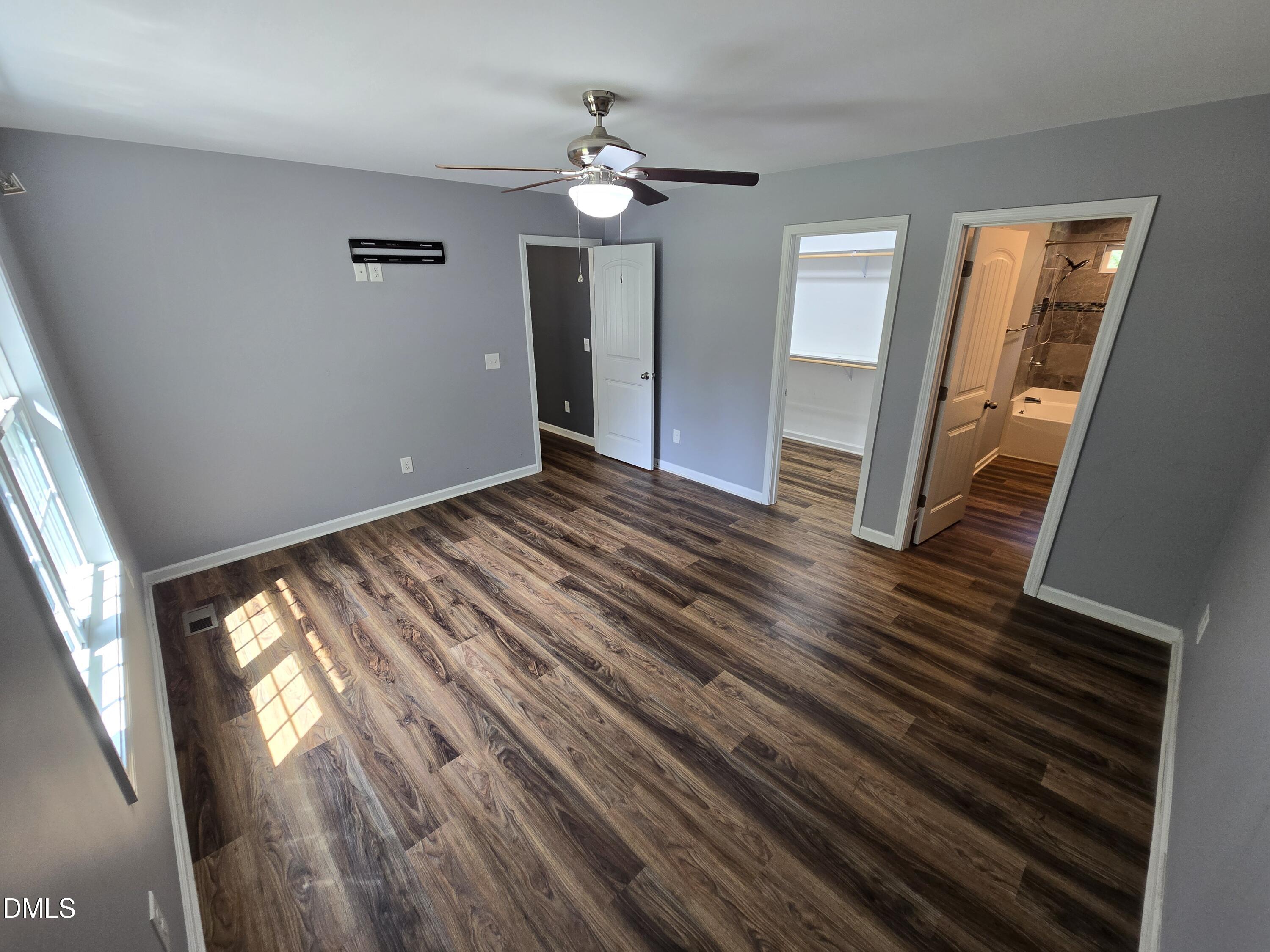 1180 Lambert Chapel Road Siler City, NC 27344 - Photo 42 of 42 wooden floor in an empty room with a window
