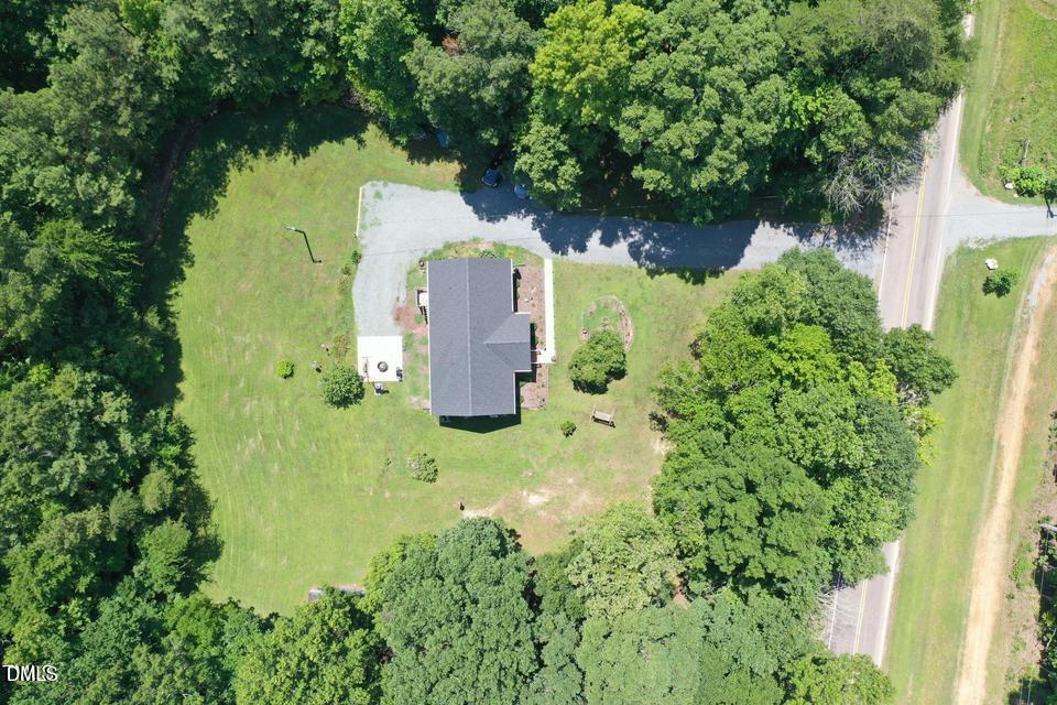 1180 Lambert Chapel Road Siler City, NC 27344 - Photo 6 of 42 an aerial view of a house with a yard
