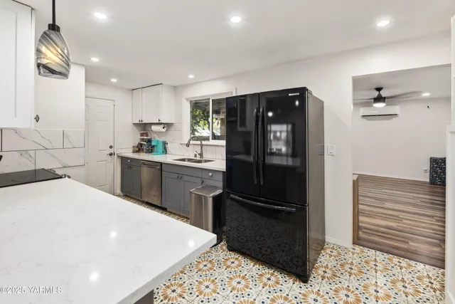 a kitchen with a sink stove and refrigerator