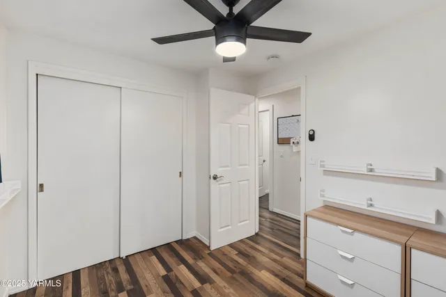 a bathroom with a double vanity sink a mirror and a shower