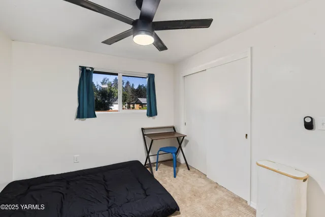 a living room with a couch and a window