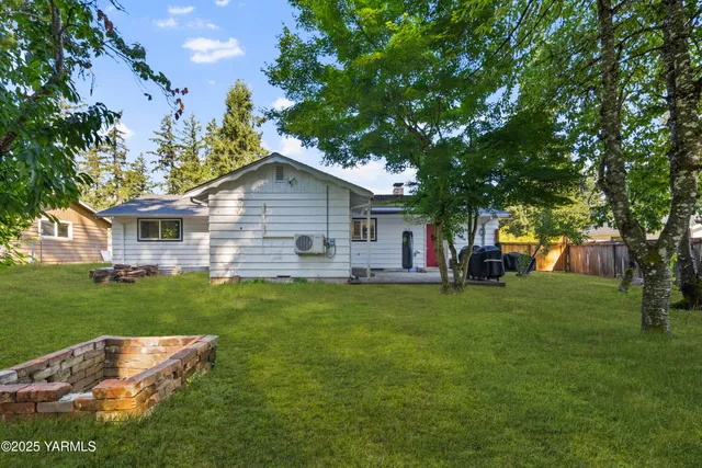a view of a park with large trees