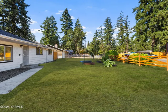 a view of a swimming pool with a garden
