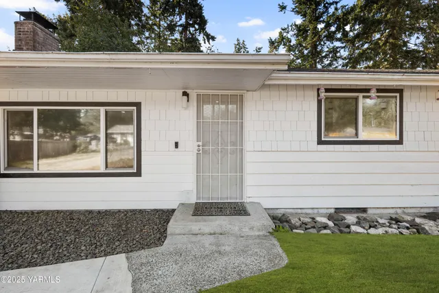 a view of kitchen with furniture and wooden floor
